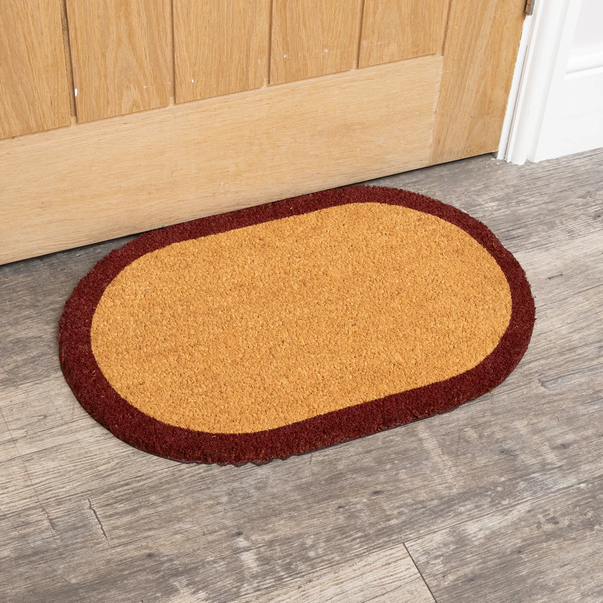 Natural Oval Coir Door Mat with a Wine Red Border - Image 3